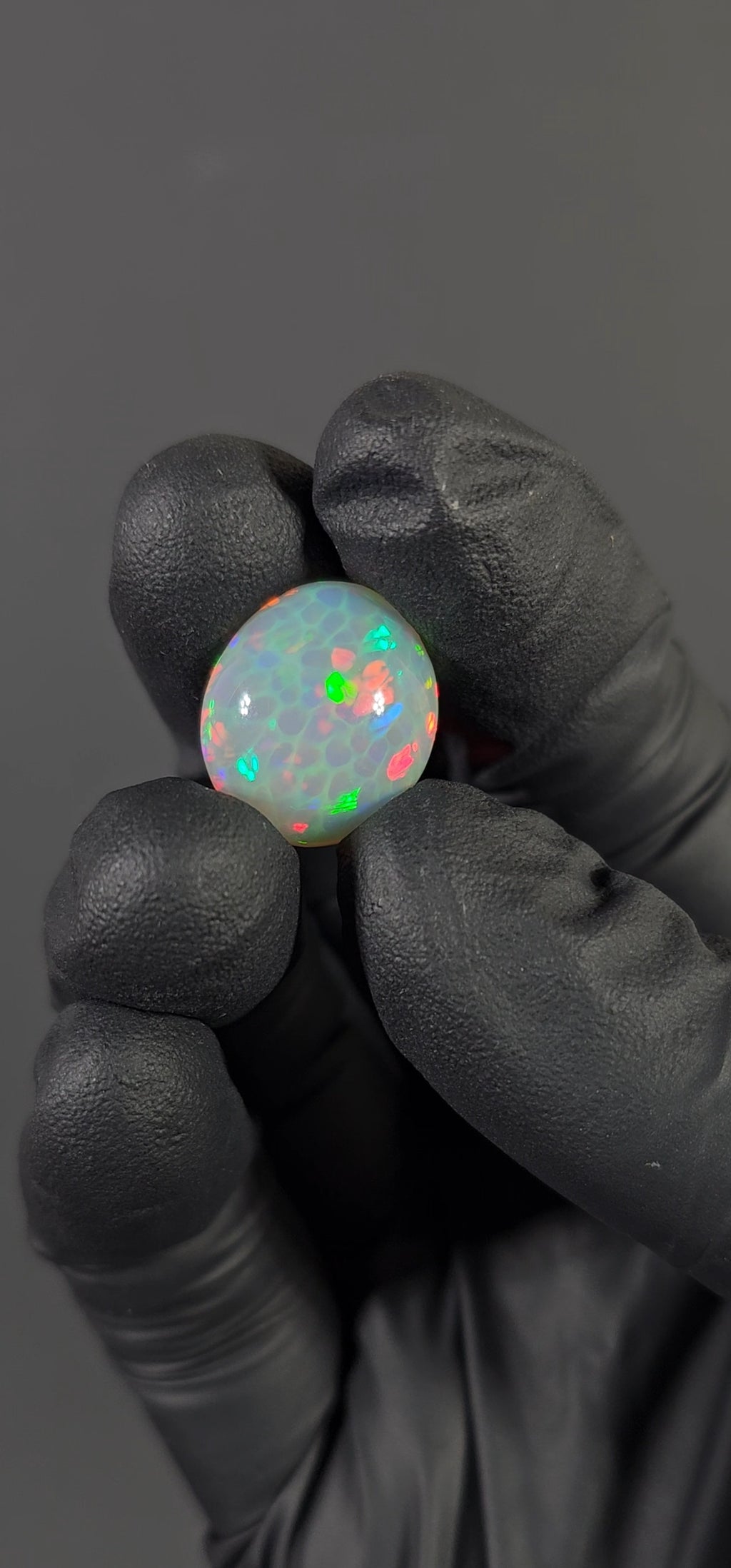 13.30 Carat Ethiopian Opal Cabochon – Honeycomb Pattern Red & Green Fire (17.82 × 15.57 × 11.10 mm)