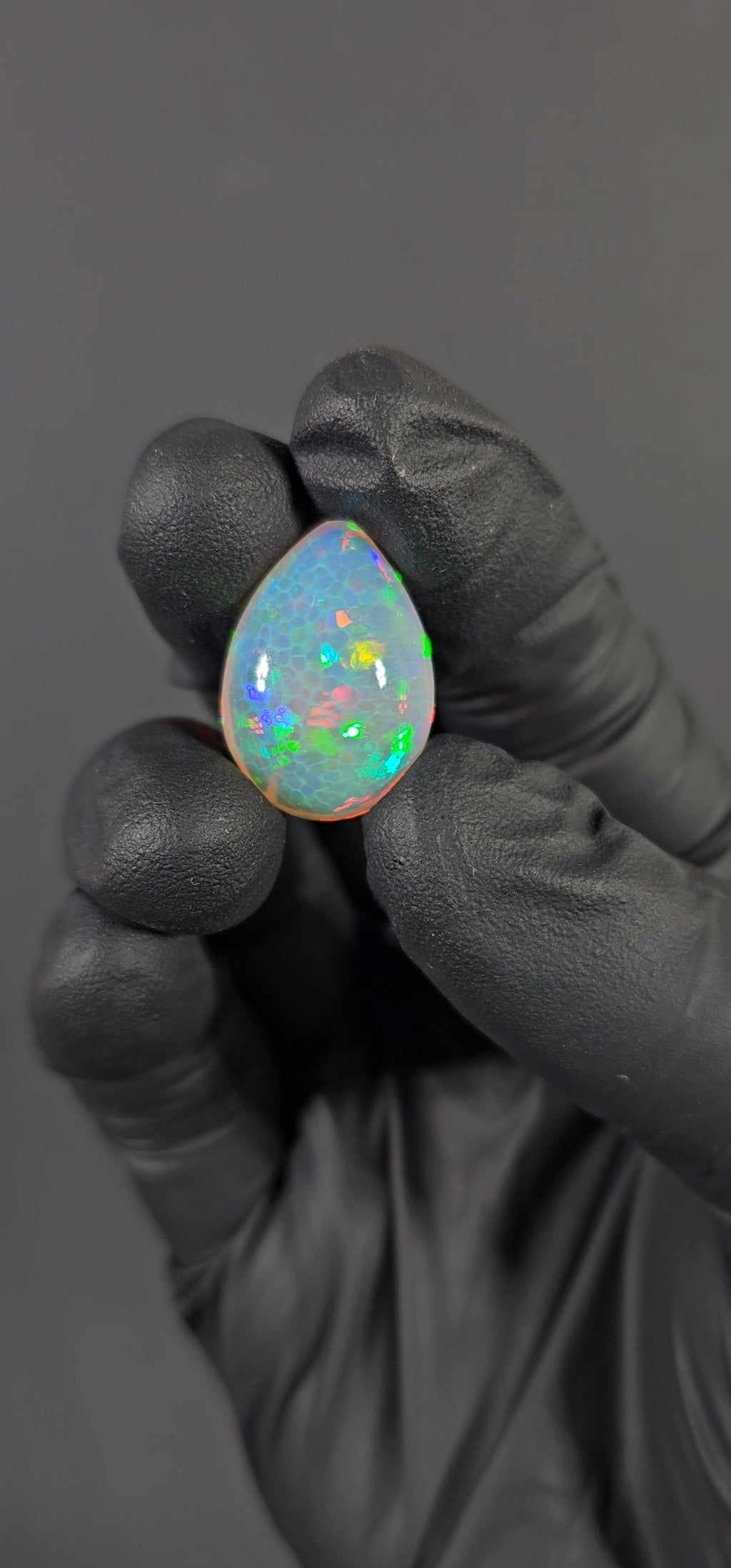 17.45 Carat Ethiopian Opal Cabochon – Honeycomb Pattern Red & Green Fire (22.73 × 16.08 × 10.06 mm)