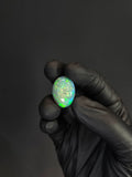22.85 Carat Ethiopian Opal Cabochon – Bright Green Fire Natural Opal (24.33 × 17.38 × 10.14 mm)